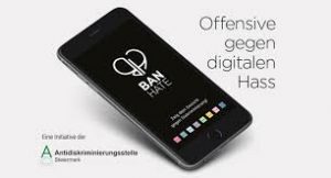 Das Bild zeigt ein Handy auf dem „Ban Hate App“ steht.